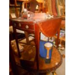 A Regency Mahogany and Inlaid Oval Pembroke Table with oval marquetry paterae to top, fitted one