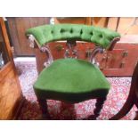 A Victorian Carved Oak Framed Tub Chair, upholstered in pale green dralon, standing on turned and