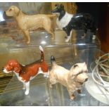 Four Beswick Figure of Dogs.