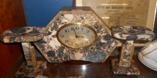 A Three Piece Art Deco Variegated Marble Clock Garniture.