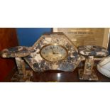 A Three Piece Art Deco Variegated Marble Clock Garniture.