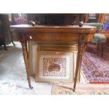 A George III Mahogany Fold-Over Card Table, standing on turned legs terminating in castors.