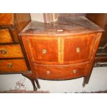 A Georgian Mahogany Bow-Front Commode with satinwood crossbanding.