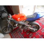 A Child's Mini Motor Bike.