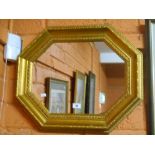 An Octagonal Gilt-Framed Wall Mirror.