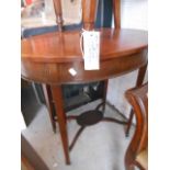 An Oval Mahogany and Inlaid Occasional Table and a 19th Century Mahogany Chair.