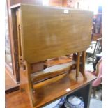 An Edwardian Mahogany Sutherland Tea Table, standing on pierced end supports united by a stretcher.