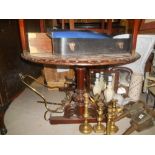 A Victorian Oval Walnut and Inlaid Table.