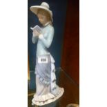 A Tall Lladro Figure of a Girl Reading a Book.