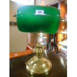 A Brass Bankers Lamp with Green Glass Shade.