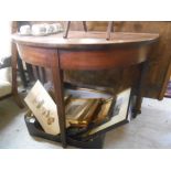 A 19th Century Mahogany Demi-Lune Side Table, standing on three tapered square supports.