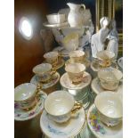 A Set of 12 Demi-Tasse Cups & Saucers, each individually decorated with flowers and with lustrous