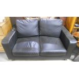 Two Black Leather Two-Seater Couches.