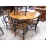 A Victorian Style Hardwood Circular Top Dining Table, having a turned pillar and tripod base, approx