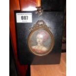 A Miniature Watercolour Portrait of a Bejewelled Lady, oval mount & black frame.