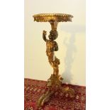 AN ITALIAN GILTWOOD, PAINTED AND PARCEL GILT BLACKAMOOR TORCHERE, IN 18TH CENTURY STYLE, 19TH