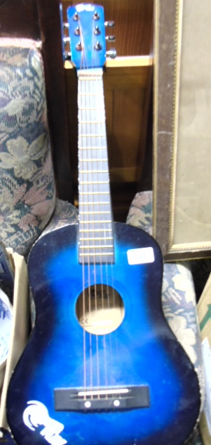 A Child's Blue Power Play Guitar.