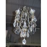 A 20th Century Brass and Glass Chandelier.