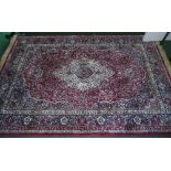 A Silk Red Ground Eastern Rug, Approx. 8ft x 5ft.