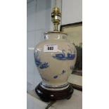 A Cracked Glaze Table Lamp with Blue Images.