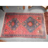 A Middle Eastern Baluchi Tribal Rug, 57" x 35".