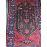 One Red and Navy Persian Rug.