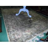A Cream Ground Rug, with fringed ends, 114" x 78".