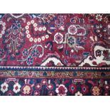 A Red Ground Eastern Rug, 89" x 54".