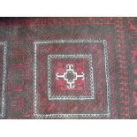 A Persian Style Red Wool Carpet with geometric detail upon a red ground, within further running
