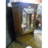 A Late 19th/early 20th Century Walnut Wall Hanging Corner Display Cabinet, with one bevelled panel