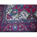 A Red Ground Persian Bakhtiar Rug.