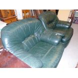 A Pair of Green Leather Armchairs.