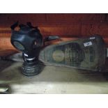 A Vintage Rubber Gas Mask and Vintage Fire Extinguisher.