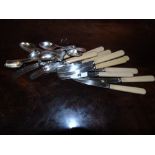 A Good Set of Twelve Bright Cut Small Tea Spoons and Matching Tongs, and a set of twelve silver