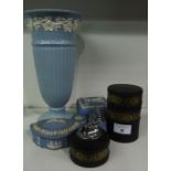 A Ribbed Wedgwood Jasperware Vase, the top decorated with trailing ivy, on a circular footed base,