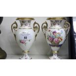 A Pair of 19th Century Twin Handled Vases, each hand painted with a baskets of summer flowers and