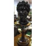 A Good Bronzed Bust of a Bearded God on a turned circular wooden base. H: 27ins.