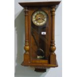 A Vienna Wall Clock, in a stained beech and walnut case.