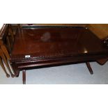 A Modern Mahogany Drop Leaf Coffee Table.