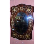 An Italian Oval Bevelled Mirror Mounted on a Parquetry Panel.