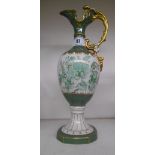 A Royal Dux Porcelain Ewer; decorated with green and gilt flowers on a flared foot.