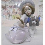 A Lladro Figure of a Girl and a Puppy.