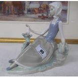 A Lladro Figure of a Girl Looking at a Bird.