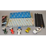 5 Scalextric cars and a qty of boxed tra