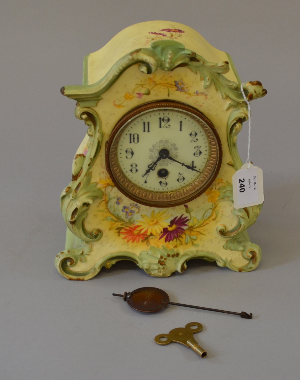 French ceramic-cased clock. With key and