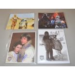 Four Star Wars signed pictures: Mark Hamill & Carrie Fisher; Peter Mayhew & Mark Hamill;