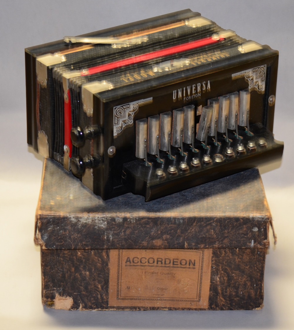 A Universal Model Accordeon with Steel Bronze Reeds, boxed.