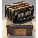 A Universal Model Accordeon with Steel Bronze Reeds, boxed.