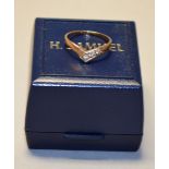 Hallmarked 9ct gold ring. Decoratively set with 3 colourless gem stones.