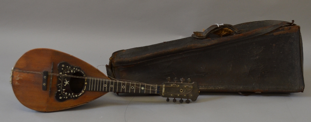 A Barnes and Mullins Mandolin with MOP inlay and leather case.